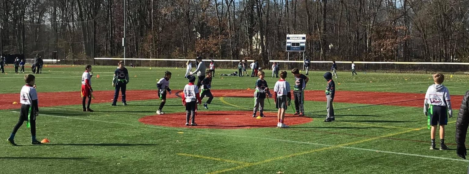 Chatham Cougars youth football players on the turf at Shunpike Field